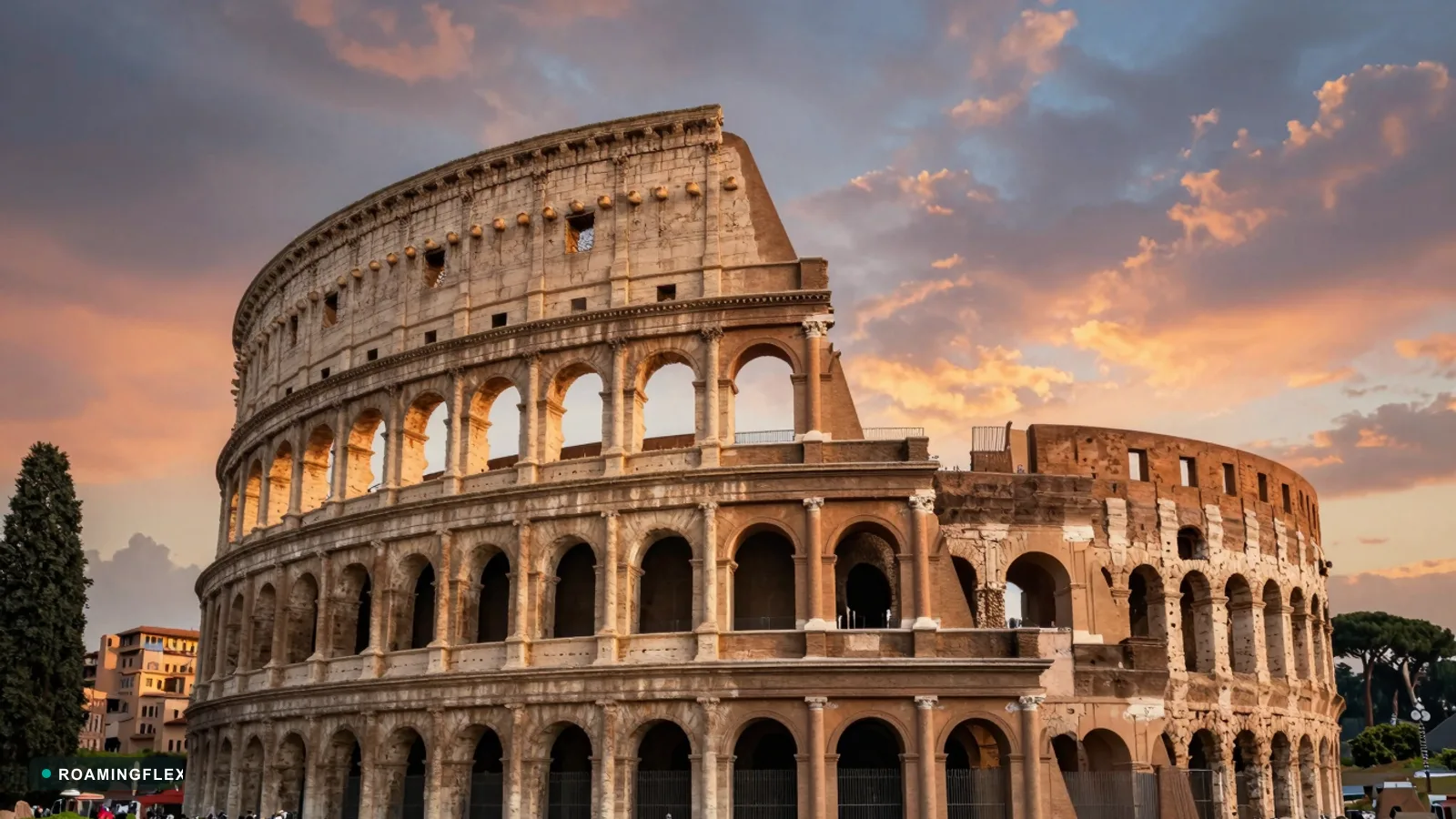 Colosseum at sunset in Rome, Italy with the Roman Forum in the background